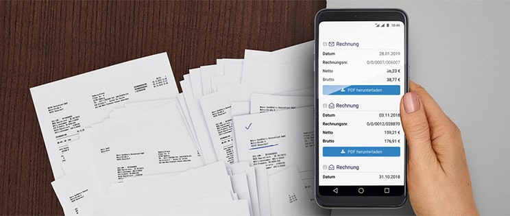 e-facture sur un mobile et factures papier sur une table