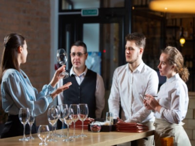 Somelier teaching about wine to chefs